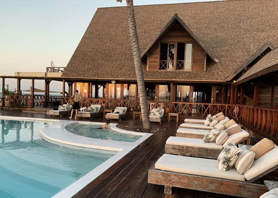 A hotel exterior with palms